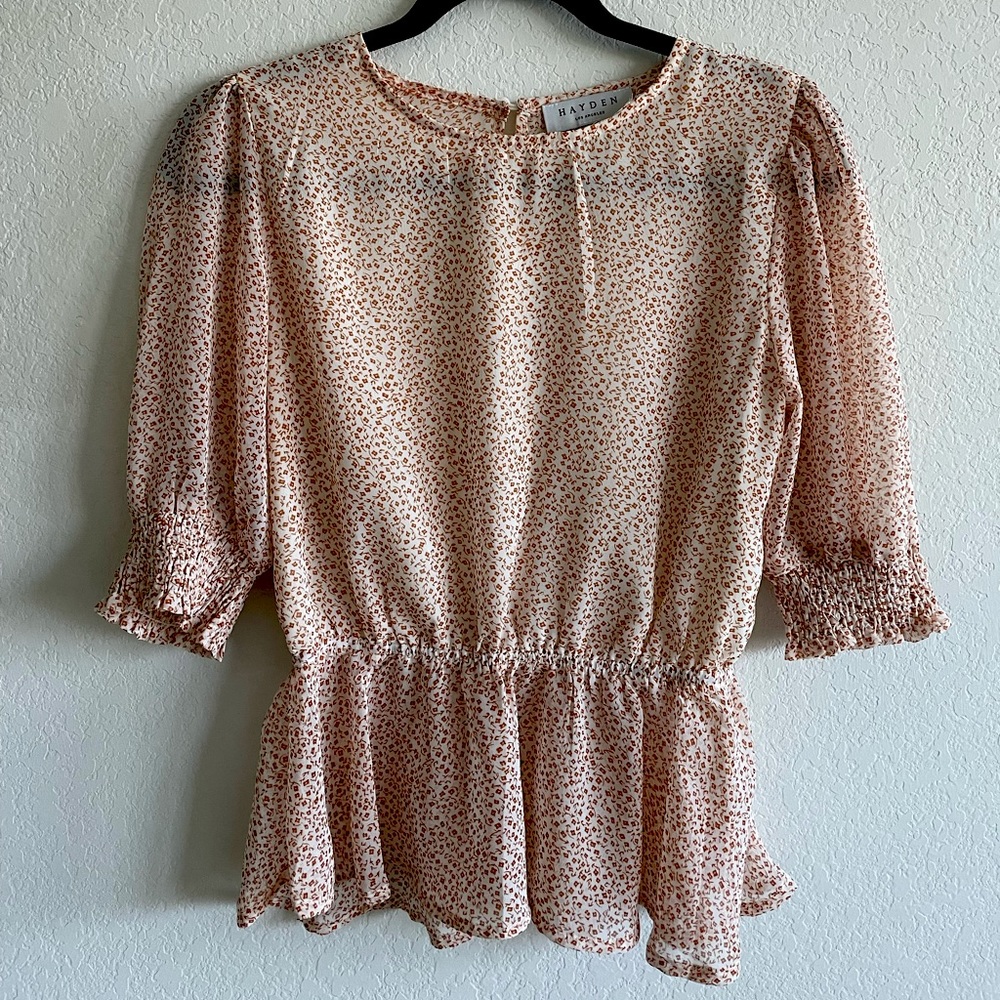 Semi sheer floral peplum blouse